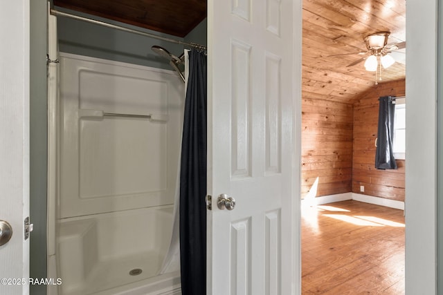 full bath featuring a shower with shower curtain, wooden walls, wood finished floors, lofted ceiling, and wood ceiling