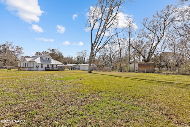 view of yard featuring an outbuilding and a storage shed