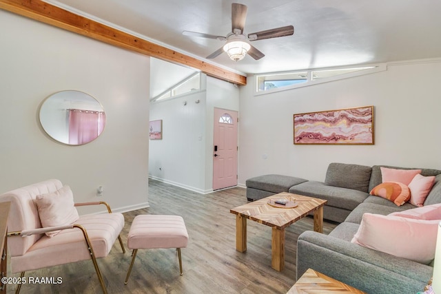 living room with ceiling fan, lofted ceiling with beams, baseboards, and wood finished floors