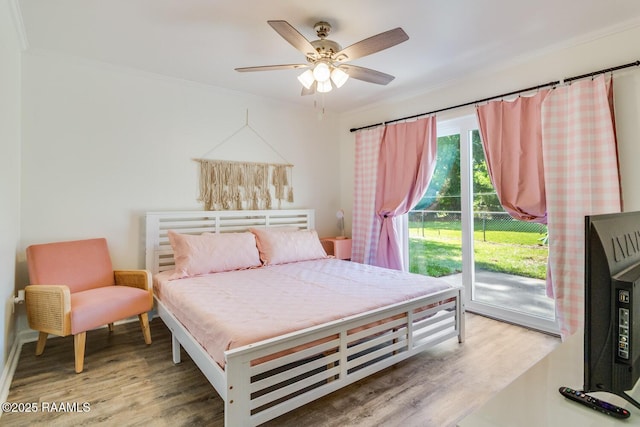 bedroom featuring ornamental molding, access to outside, ceiling fan, and wood finished floors