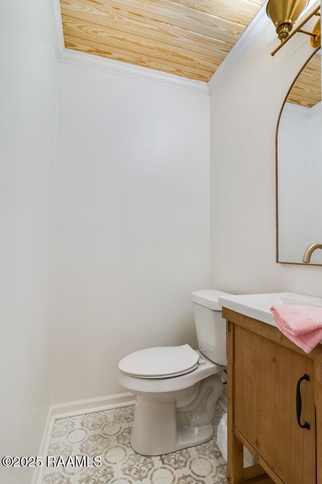 bathroom with toilet, ornamental molding, wood ceiling, vanity, and tile patterned flooring