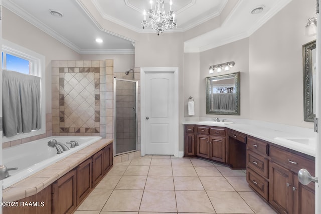 bathroom with double vanity, a stall shower, a sink, and tile patterned floors