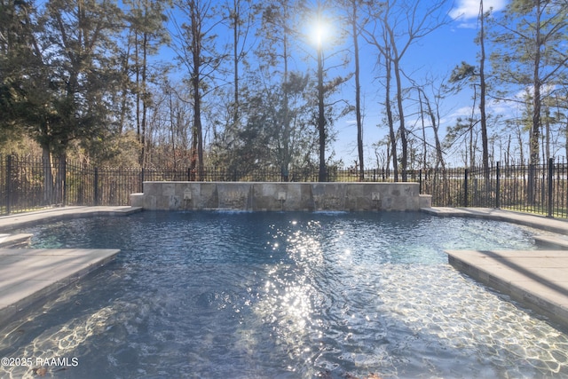 view of pool with fence and a fenced in pool