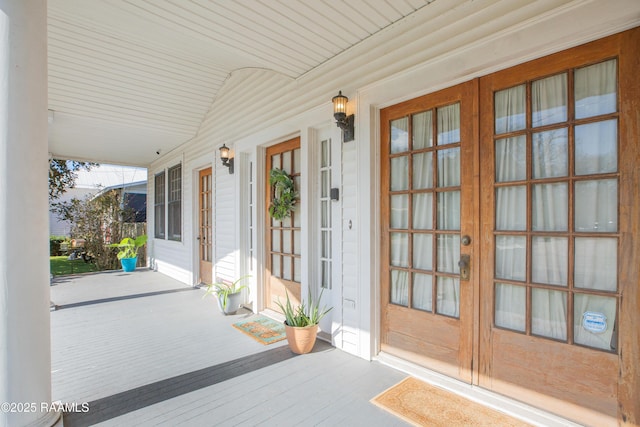 doorway to property featuring a porch