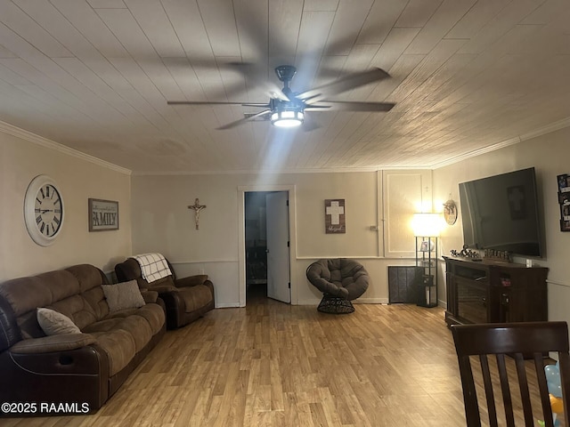 living room featuring wooden ceiling, crown molding, a ceiling fan, and wood finished floors