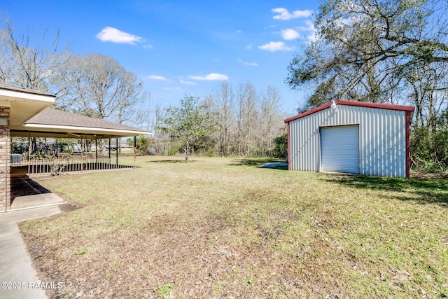 view of yard with an outbuilding and a garage