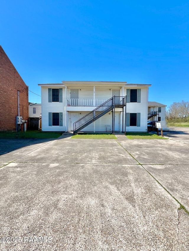 view of front of property with stairway