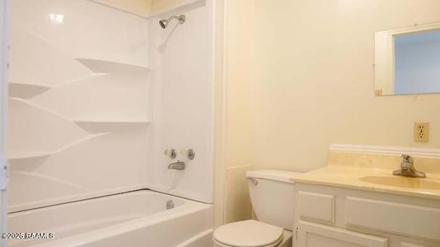 full bathroom featuring shower / washtub combination, vanity, and toilet