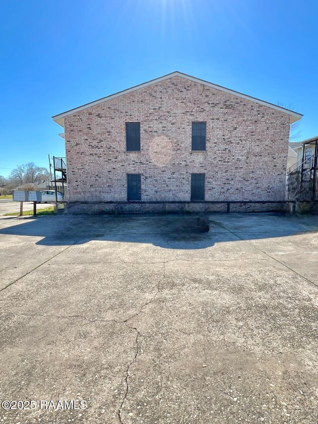 view of side of property with brick siding