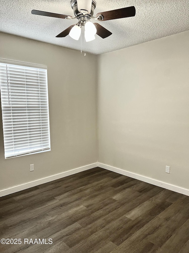 151 Kenneth Boagni Sr Dr, Opelousas, LA 70570 - empty room featuring a ceiling fan, dark wood-type flooring, a textured ceiling, and baseboards