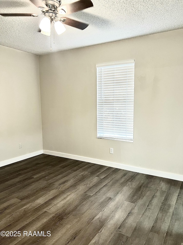 151 Kenneth Boagni Sr Dr, Opelousas, LA 70570 - empty room with dark wood-style floors, a ceiling fan, a textured ceiling, and baseboards
