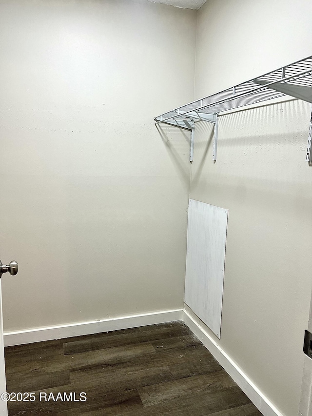 151 Kenneth Boagni Sr Dr, Opelousas, LA 70570 - walk in closet featuring dark wood finished floors