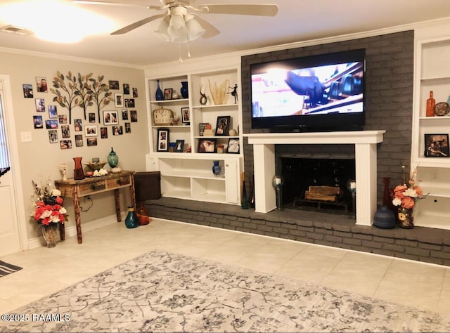 tiled living room with a brick fireplace, visible vents, built in features, and crown molding