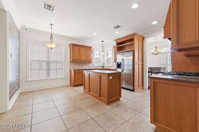 kitchen featuring open shelves, visible vents, stainless steel appliances, and crown molding