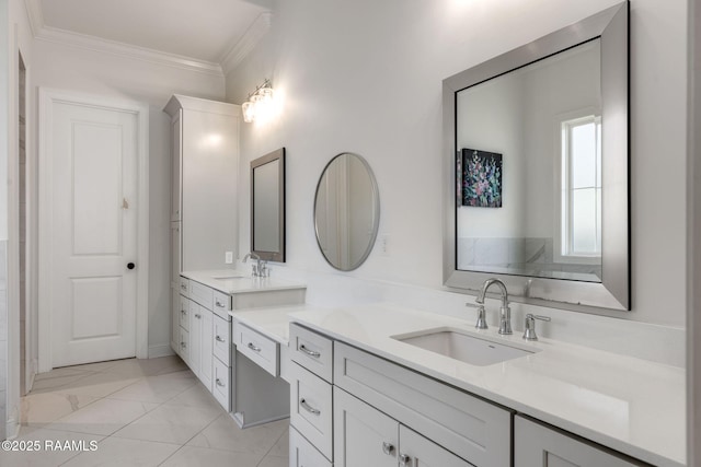 full bathroom featuring double vanity, ornamental molding, marble finish floor, and a sink