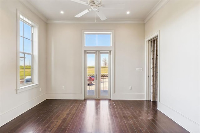 unfurnished room featuring dark wood-style floors, ornamental molding, recessed lighting, and baseboards