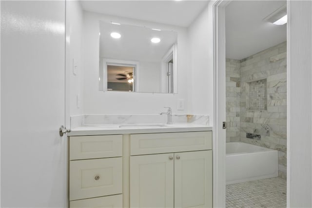 bathroom featuring tub / shower combination and vanity