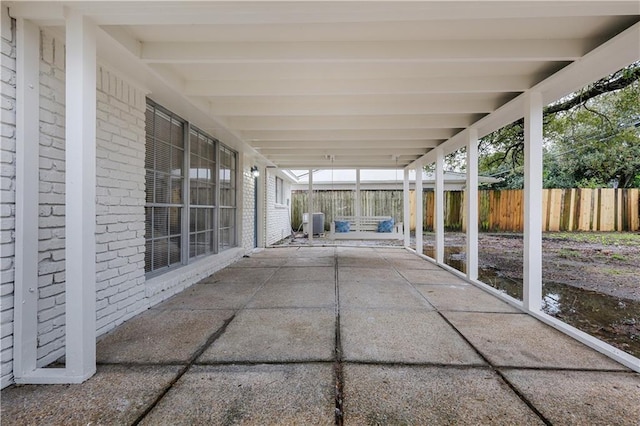 view of patio / terrace featuring central AC and fence