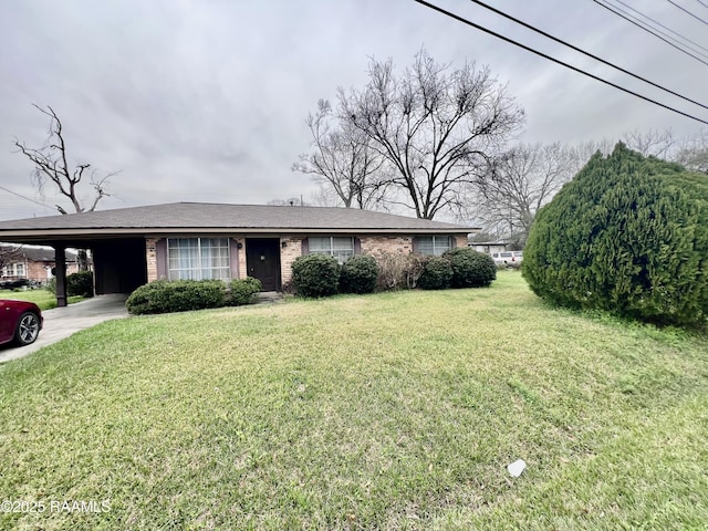 ranch-style home with a carport, a front yard, concrete driveway, and brick siding