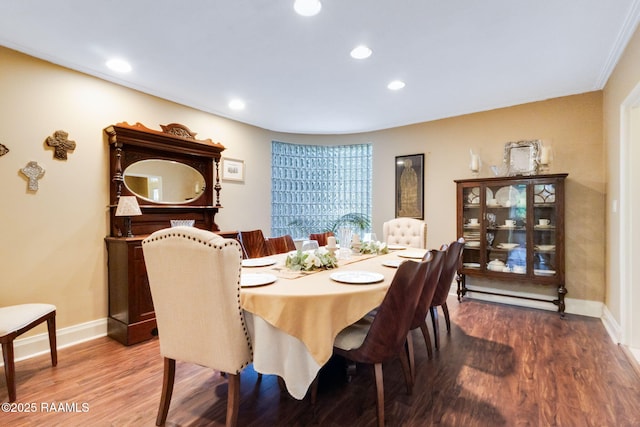 dining room with baseboards, recessed lighting, and wood finished floors