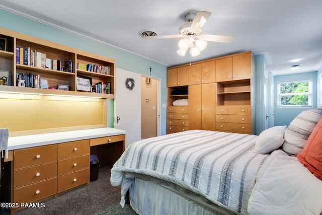 bedroom with crown molding, carpet floors, a ceiling fan, visible vents, and a closet