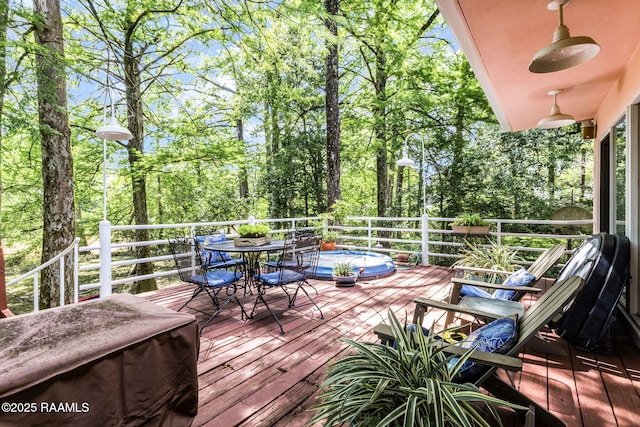 wooden terrace featuring outdoor dining space