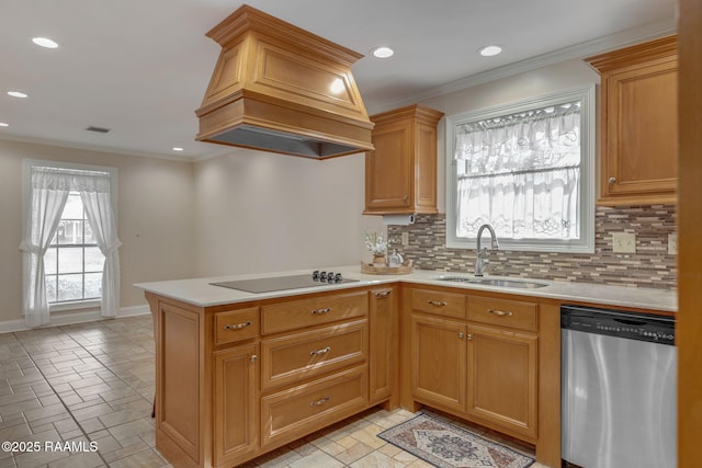 kitchen featuring dishwasher, black electric stovetop, light countertops, premium range hood, and a sink