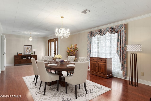 dining area with dark wood-style floors, a healthy amount of sunlight, and visible vents