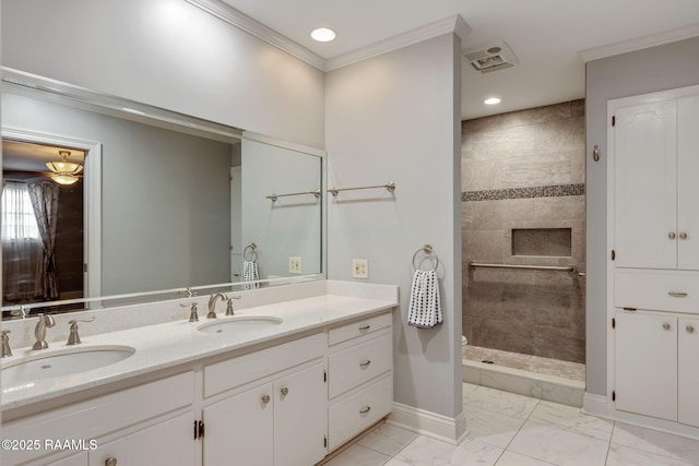 bathroom with a walk in shower, marble finish floor, ornamental molding, and a sink