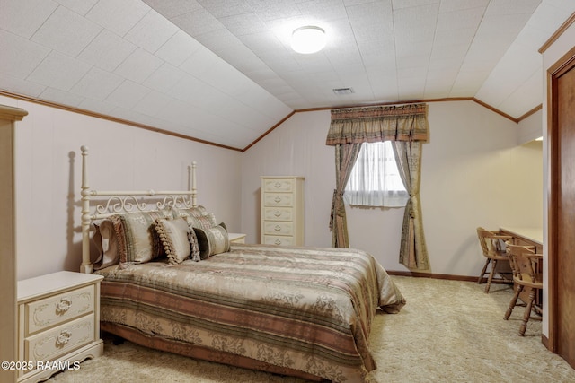 carpeted bedroom featuring vaulted ceiling, ornamental molding, and baseboards