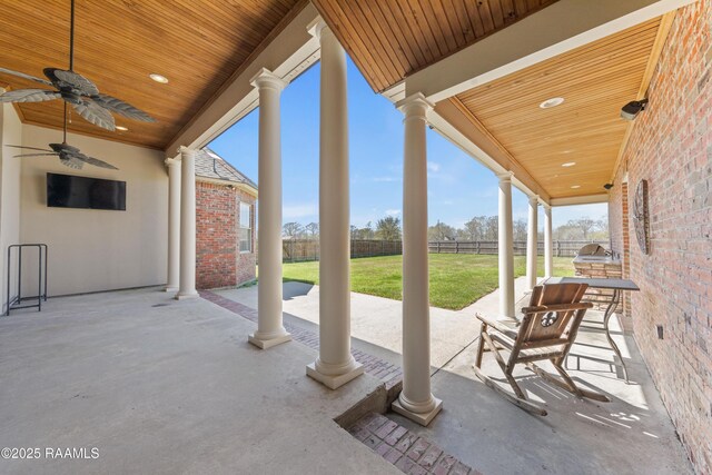 view of patio / terrace featuring a ceiling fan and fence