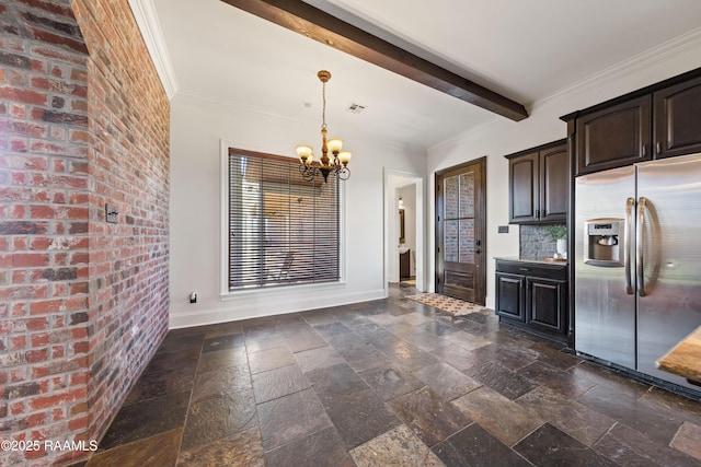 kitchen featuring stone tile floors, baseboards, beam ceiling, ornamental molding, and stainless steel refrigerator with ice dispenser