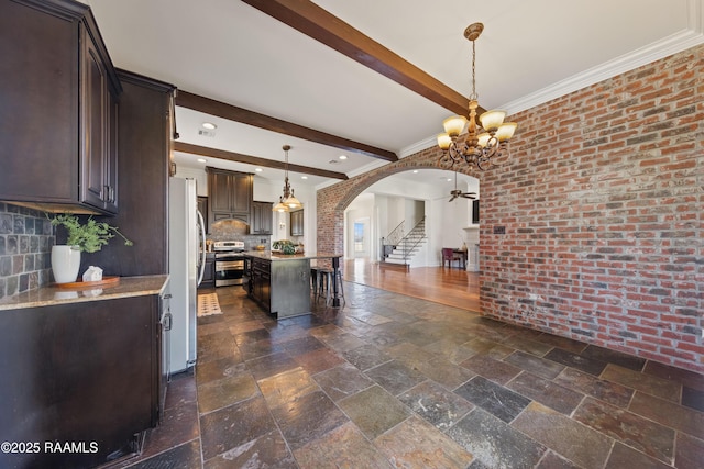 kitchen featuring dark brown cabinetry, stone tile floors, beam ceiling, stainless steel range with electric stovetop, and arched walkways