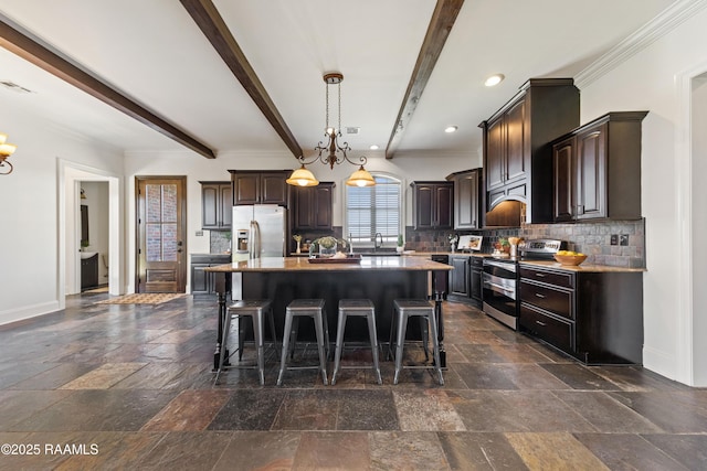 kitchen with dark brown cabinetry, stainless steel appliances, a breakfast bar, and a sink