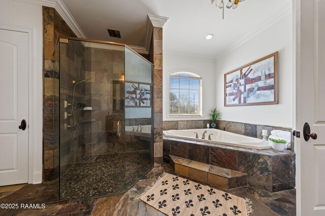 bathroom with a bath, a stall shower, and ornamental molding