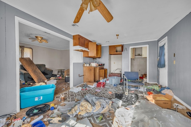 living area featuring visible vents and a ceiling fan