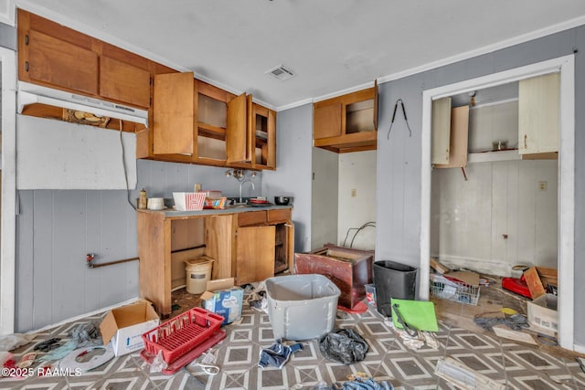 kitchen featuring visible vents and brown cabinets