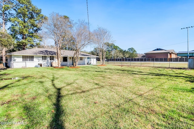 view of yard with fence