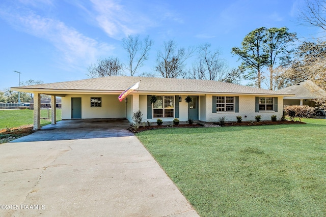 ranch-style house featuring fence, driveway, a front lawn, a carport, and brick siding