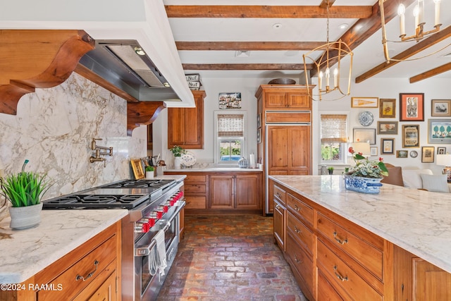 kitchen with brick floor, high quality appliances, backsplash, brown cabinets, and beamed ceiling