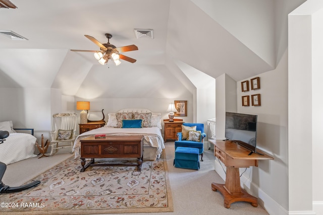 carpeted bedroom with lofted ceiling, baseboards, visible vents, and a ceiling fan