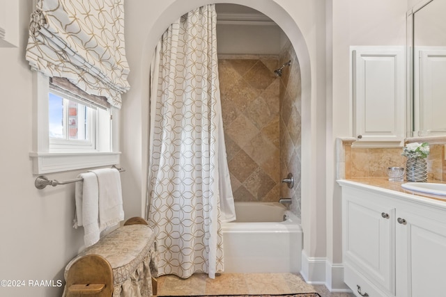 bathroom with shower / bath combination with curtain and vanity