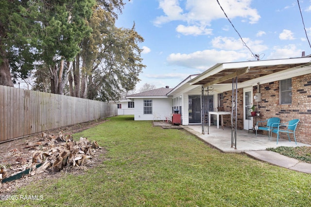 view of yard with a patio area and a fenced backyard