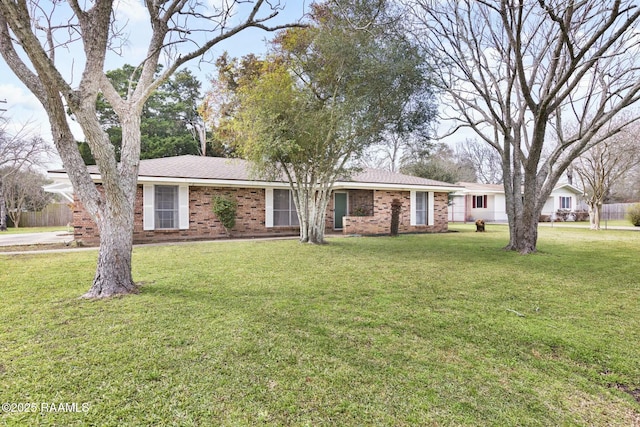 single story home with brick siding and a front lawn