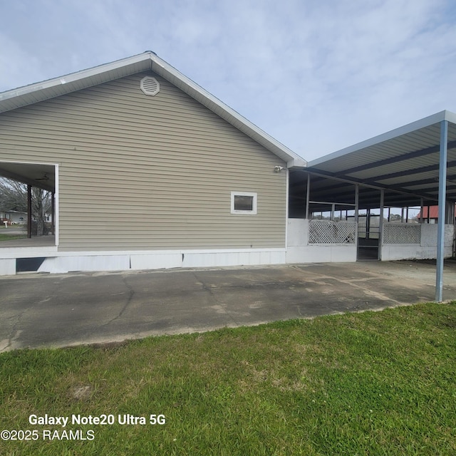 view of property exterior featuring an attached carport