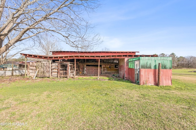 view of pole building with a lawn