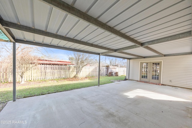 view of patio with french doors and fence