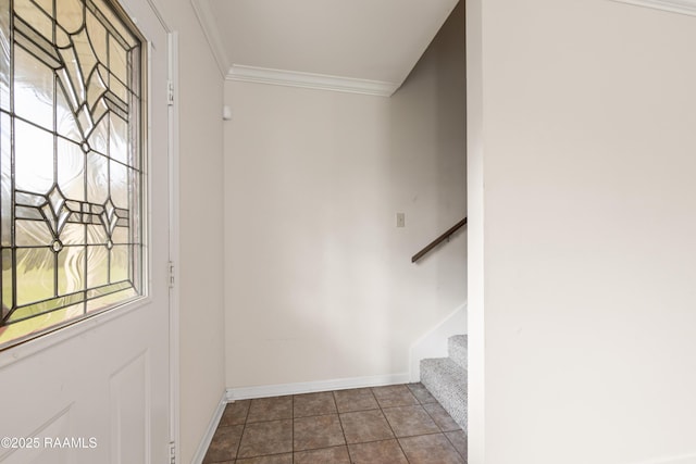stairs with tile patterned flooring, baseboards, and ornamental molding