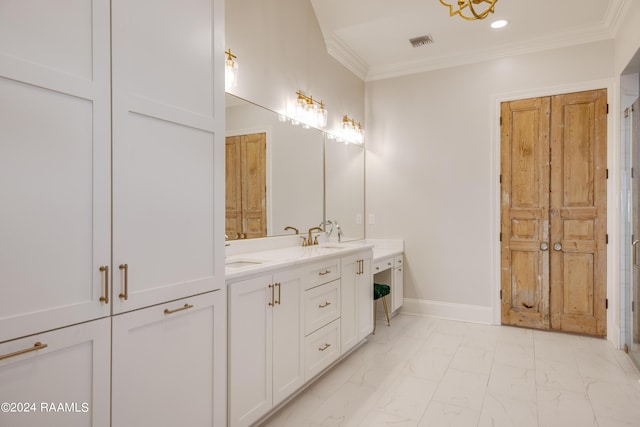 bathroom featuring marble finish floor, double vanity, ornamental molding, a sink, and baseboards