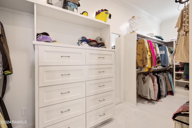 spacious closet featuring marble finish floor